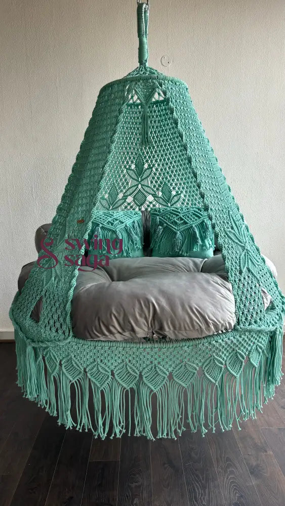 Handwoven cyan bed swing 60 inches round for indoor and outdoor use. comes with 2 macrame cushion and comfortable mattress.