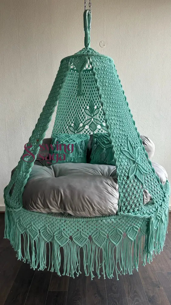 Detailed side view of macrame bed swing for a cozy room corner.