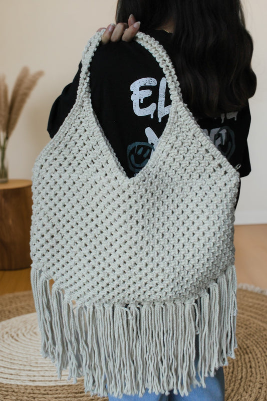 photo of a macrame bag on a girls shoulder. For everyday use and party use