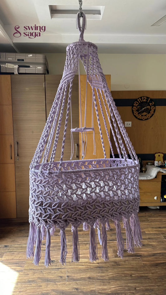 baby hammock cradle in lavender in room setting.