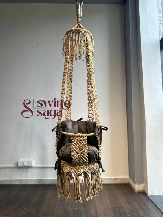 Hanging toddler macrame baby swing in beige color full view.