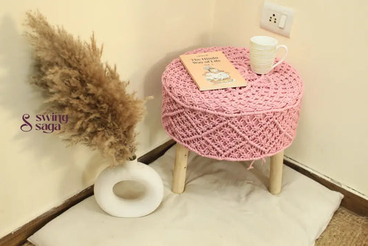 Baby pink ottoman made with macrame cords.