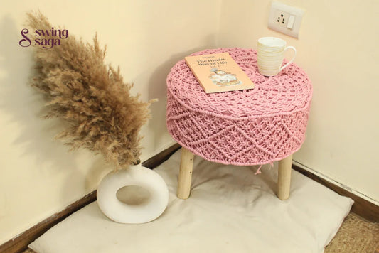 Baby pink ottoman made with macrame cords.
