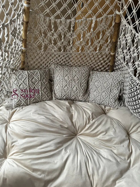 Close up shot of a white macrame teepee.