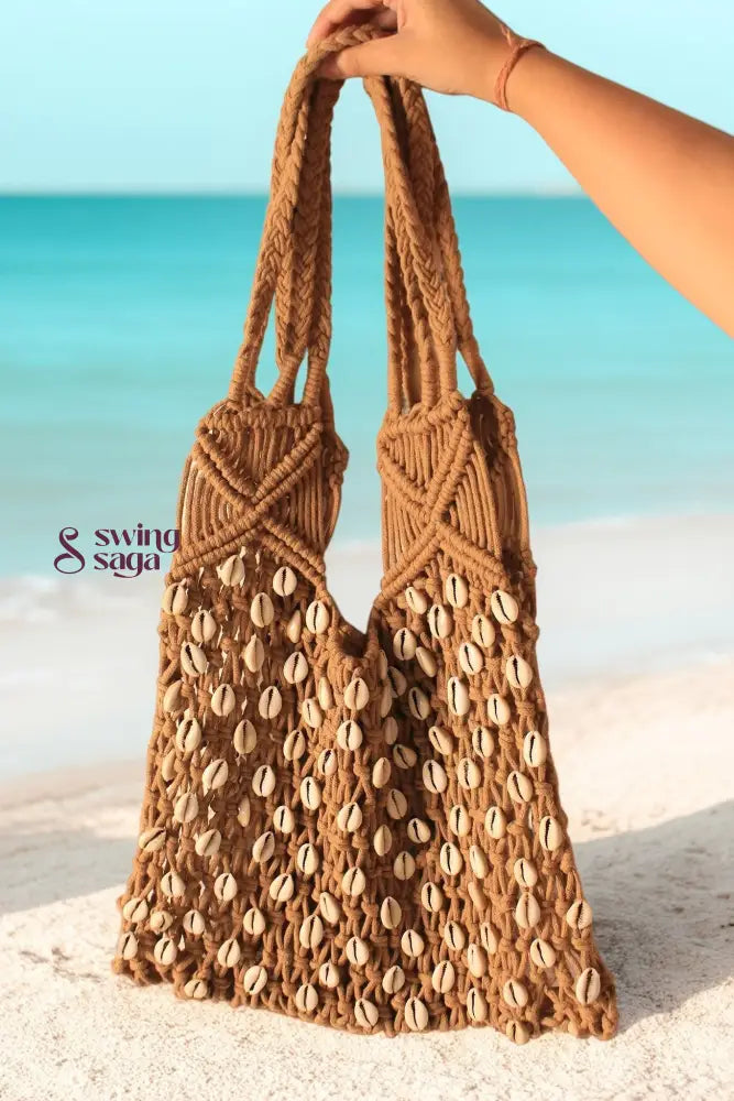 A girl holding a beige color bag with corn shells for everyday use on a beach, or for casual outing