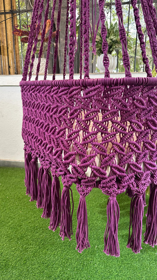 purple handcrafted macrame baby swing for toddlers.