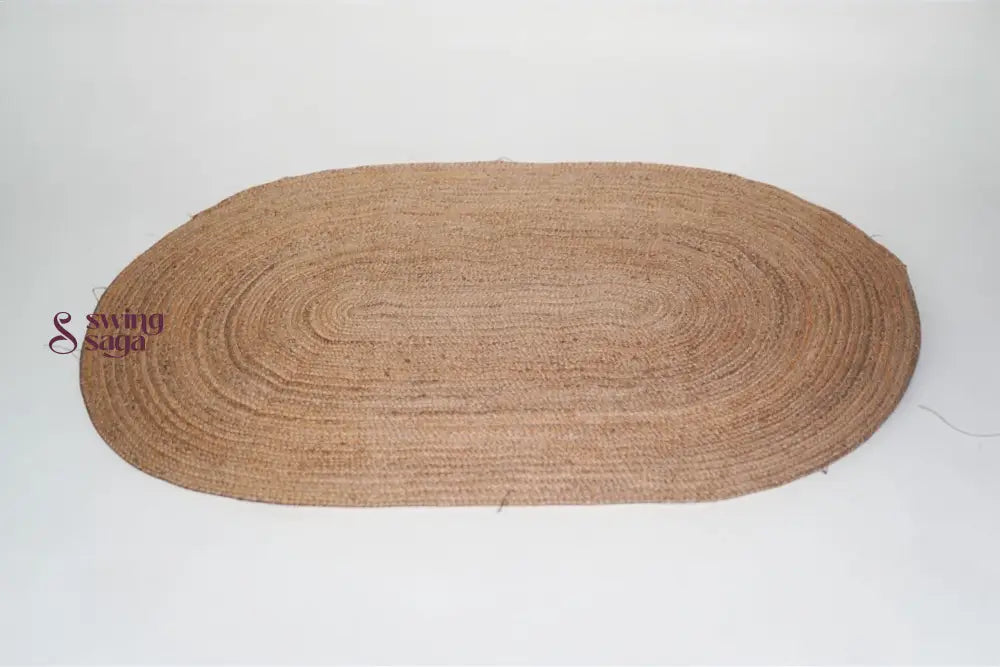 Brown oval braided rug on a white background