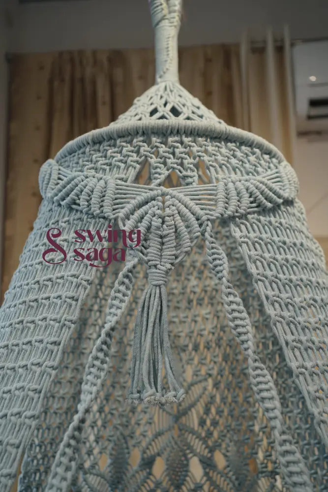 Close-up of a textured fabric with tassels on a blurred background