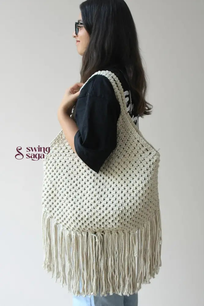 women carrying handcrafted fringe tote shoulder bag with long fringes for everyday use.
