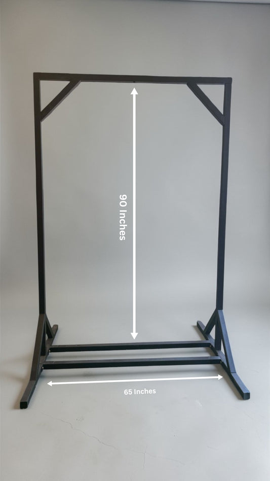 Black metal stand with measurements on a gray background