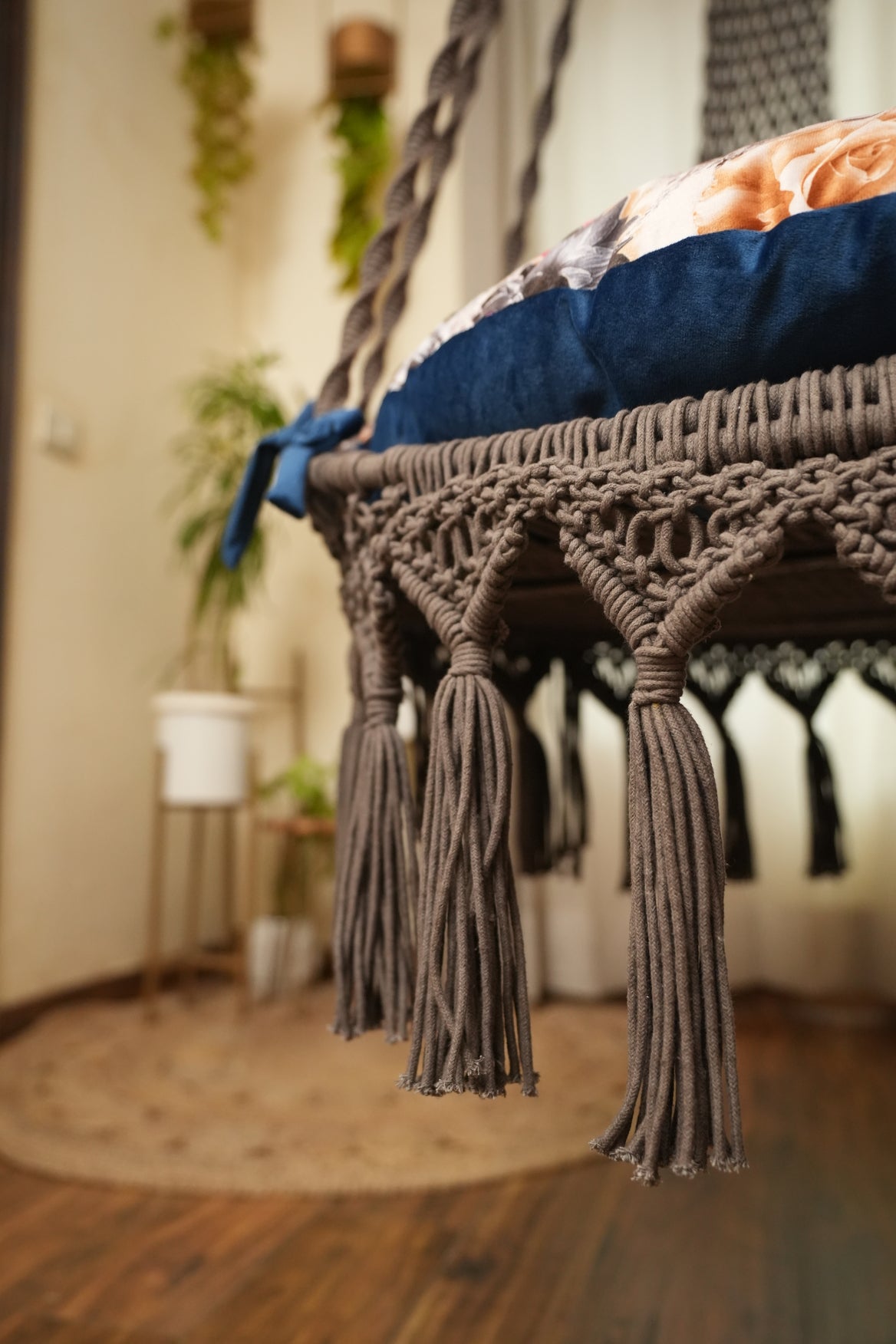 Close up of a macrame swing in brown color.