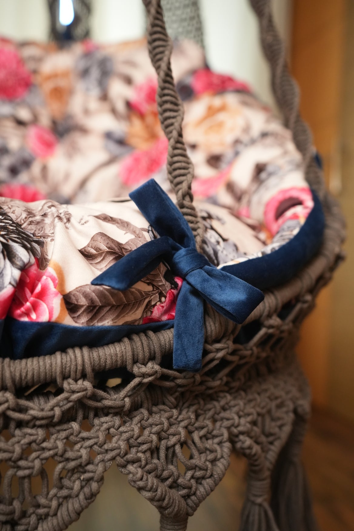 Close up of a macrame swing in brown color.