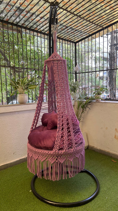 pink macrame handmade swing hang on a metal  stand.