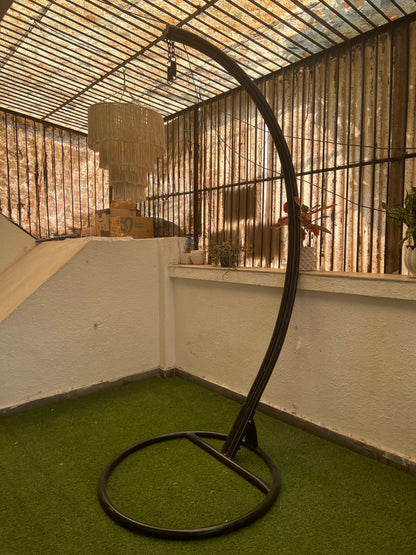 black metal stand on a faux grass mat.