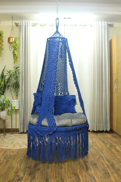 macrame hanging chair swing in blue color.