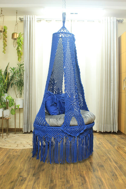 macrame hanging chair swing in blue color.