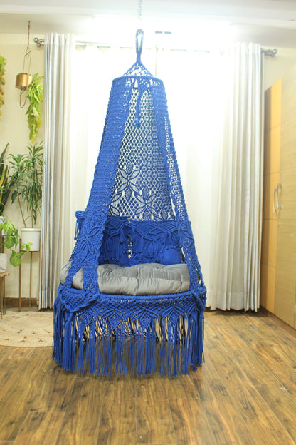 macrame hanging chair swing in blue color.