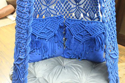 Close up of a macrame swing in blue color.