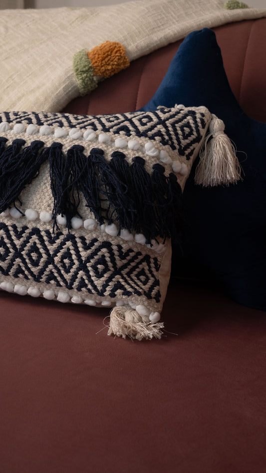 Decorative pillow with tassels on a couch
