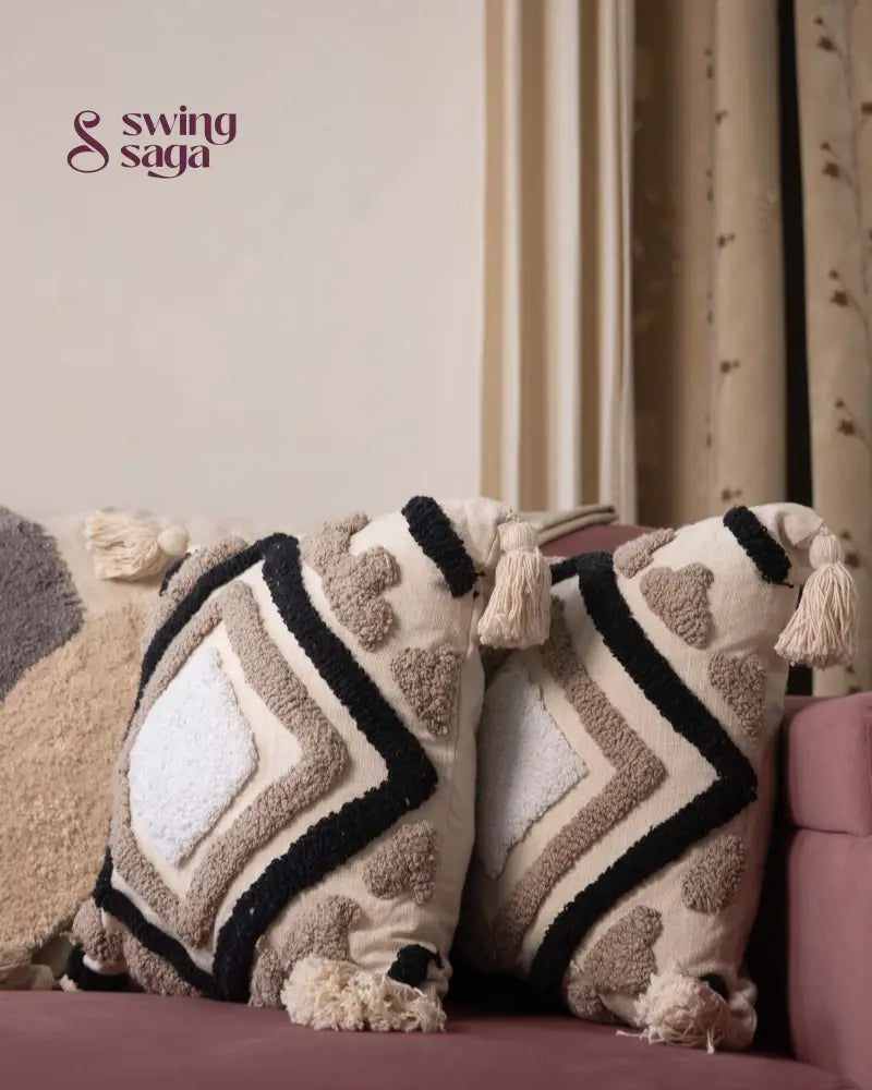 pair of square sofa cushions in white color with black tufted print