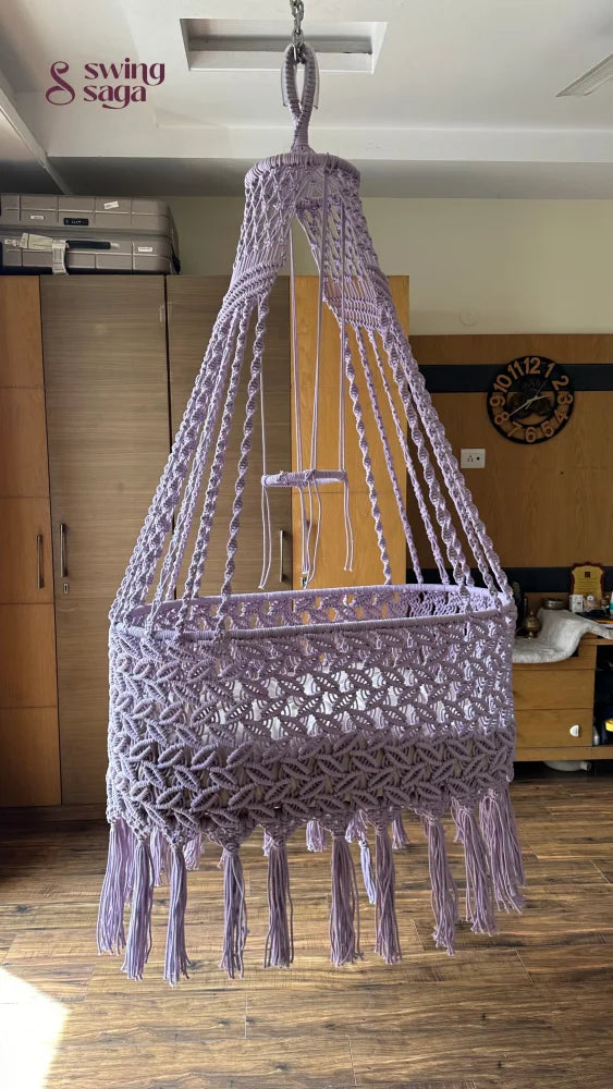 baby hammock cradle in lavender in  room setting. 