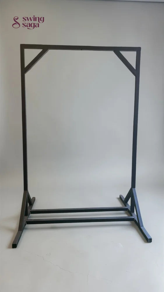Black metal garment rack on a white background