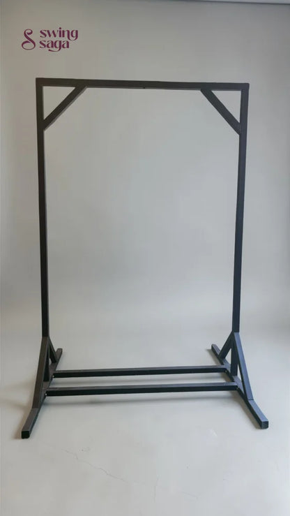 Black metal garment rack on a white background