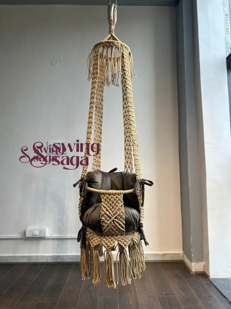 Hanging toddler macrame baby swing in beige color full view.