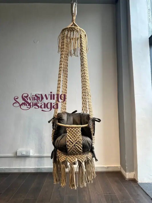 Hanging toddler macrame baby swing in beige color full view.
