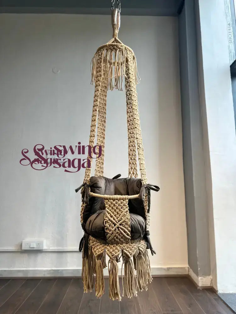 beige color baby swing front view with dark brown color mattress and backrest.