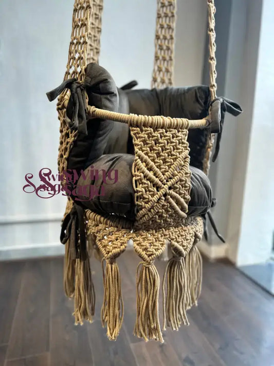 image of beige color handcrafted macrame swing front view the swing has one backrest support and one mattress.