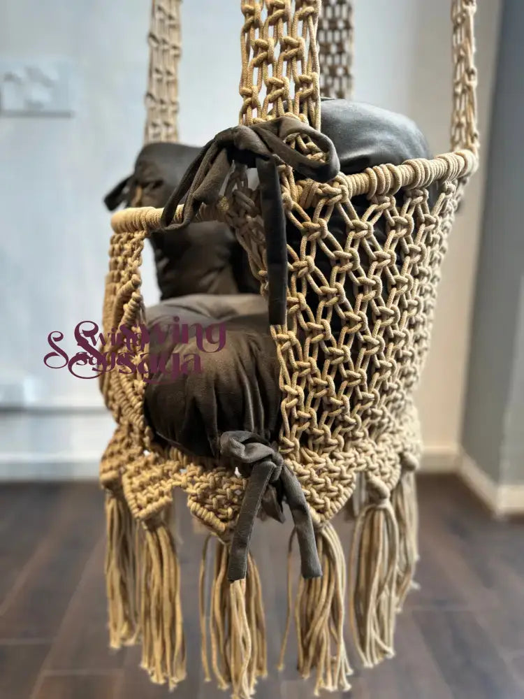 handcrafted baby swing with beads on the back and front for your baby's comfortable seating.