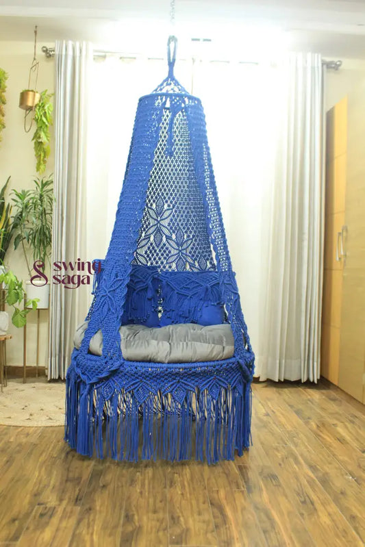 macrame hanging chair swing in blue color.