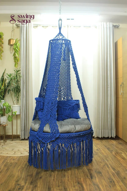 handcrafted macrame swing in blue color.