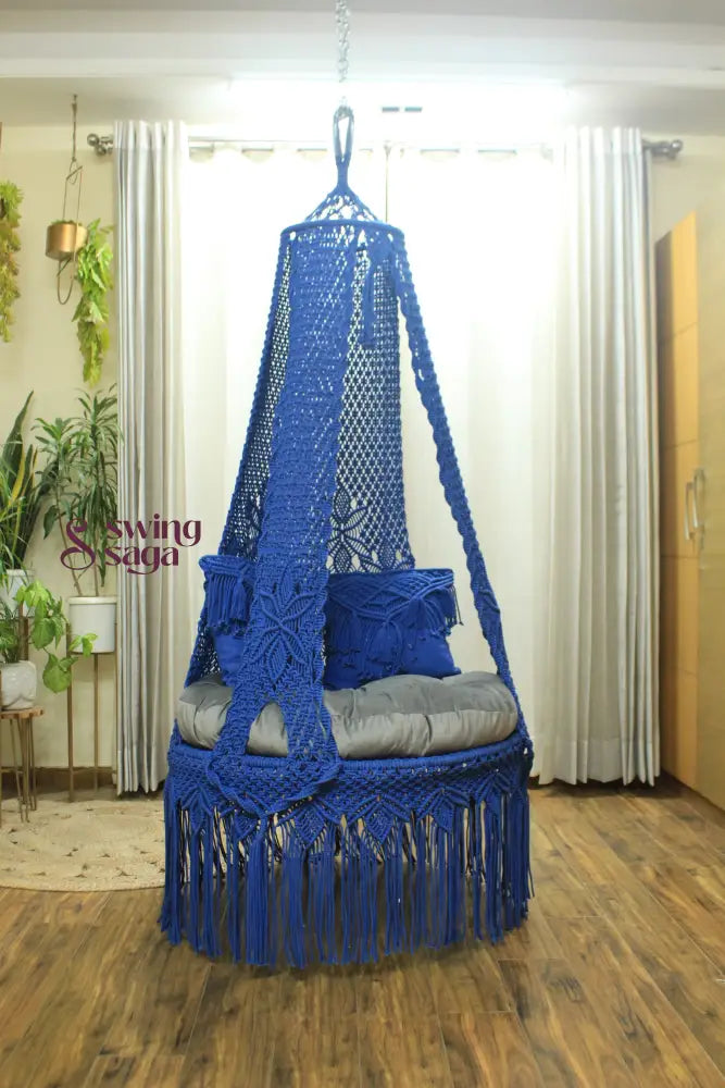 handcrafted macrame swing in blue color.