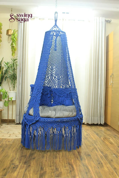 macrame hanging chair swing in blue color.