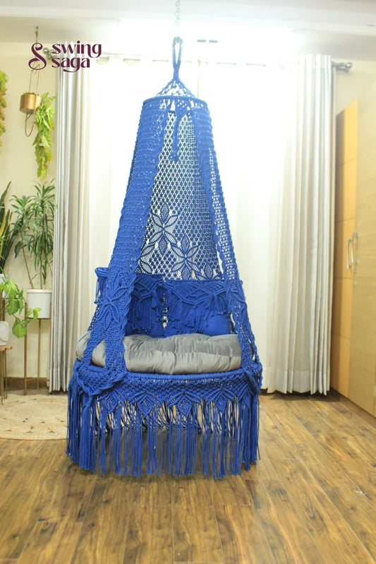 macrame hanging chair swing in blue color.