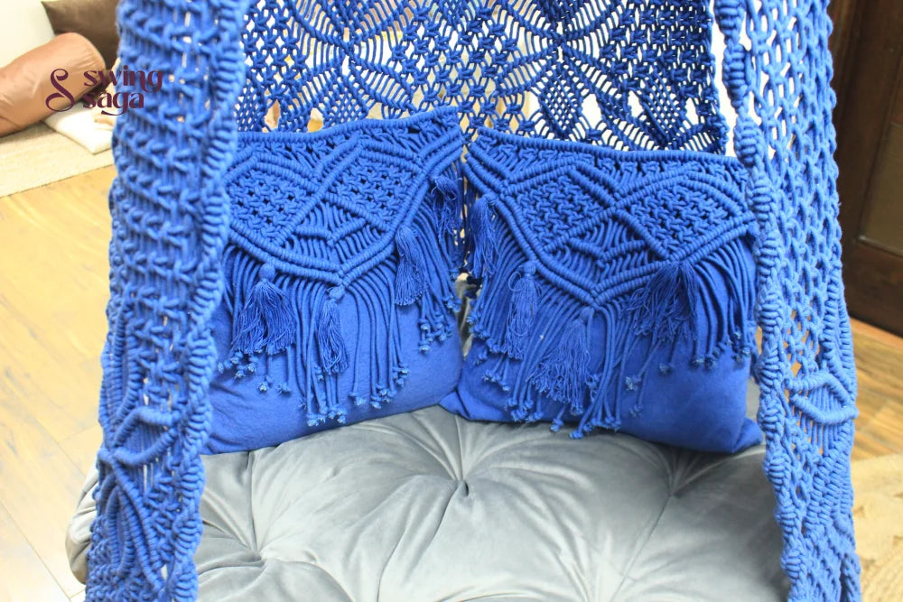 Close up of a macrame swing in blue color.