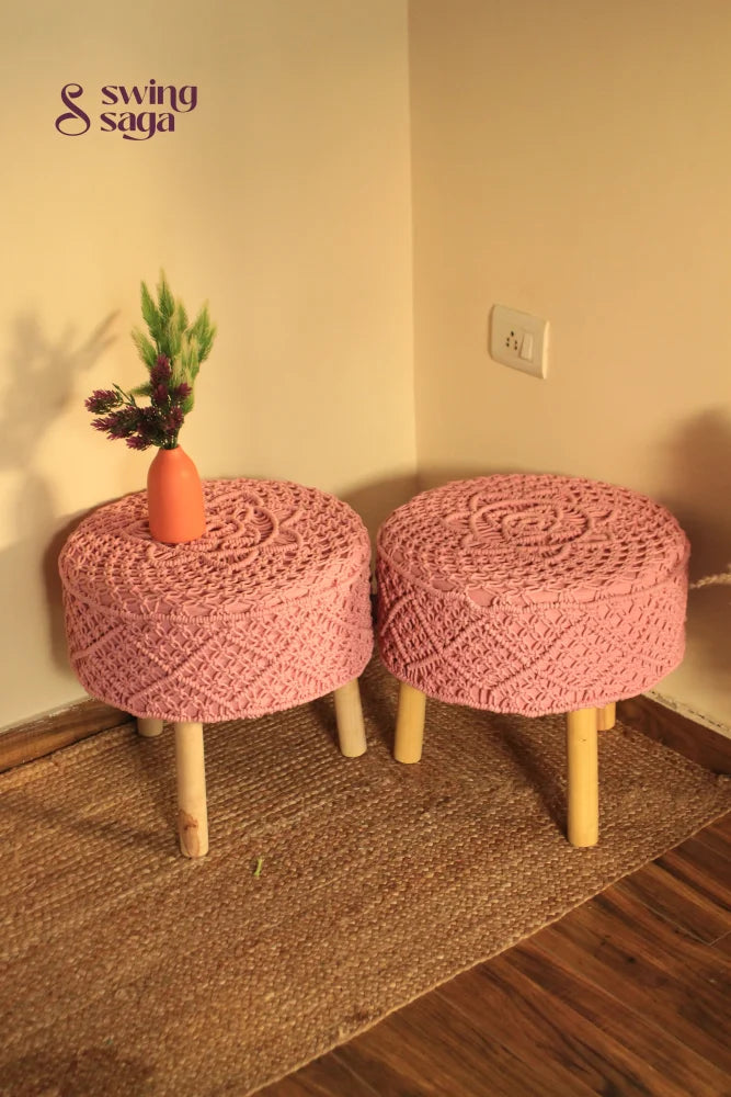 Baby pink macrame handwoven ottoman with wooden legs.