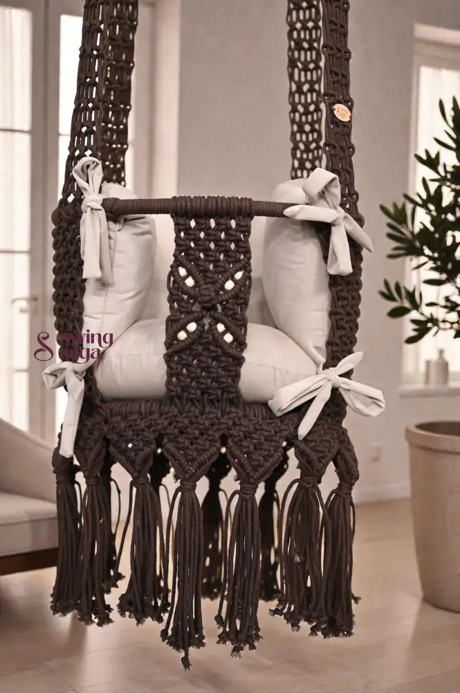 Macrame Baby Swing with cushions in a room setting
