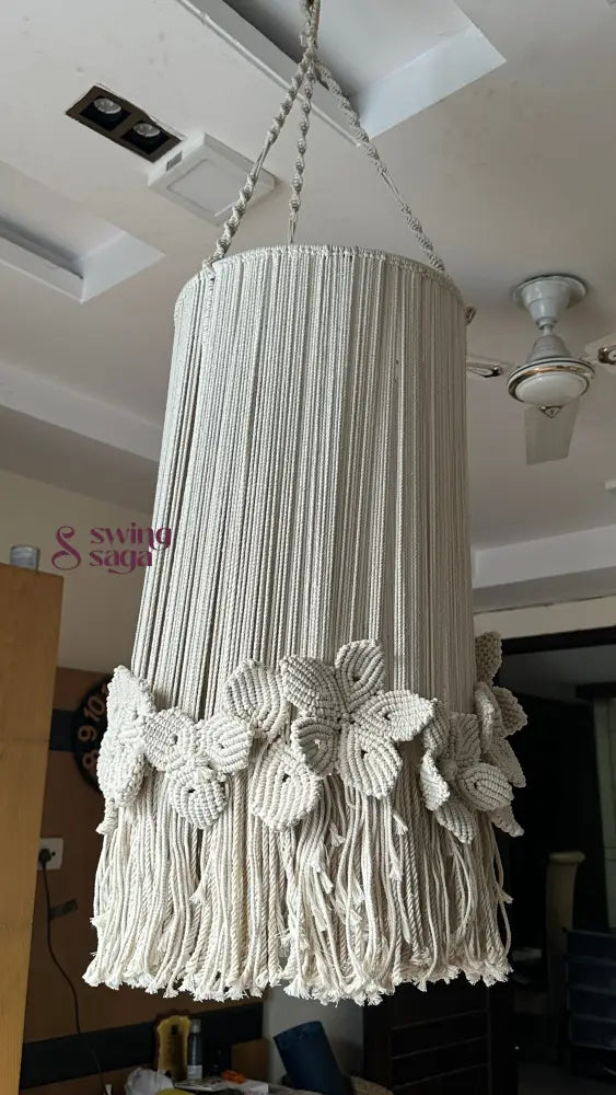 Creame macrame handcrafted chandelier with floral accents attached with a top hanging ring