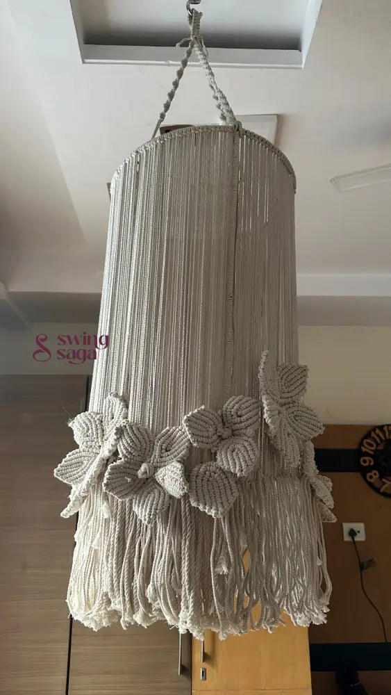 Elegant cream macrame chandelier featuring floral detailing and a ring style top hanger