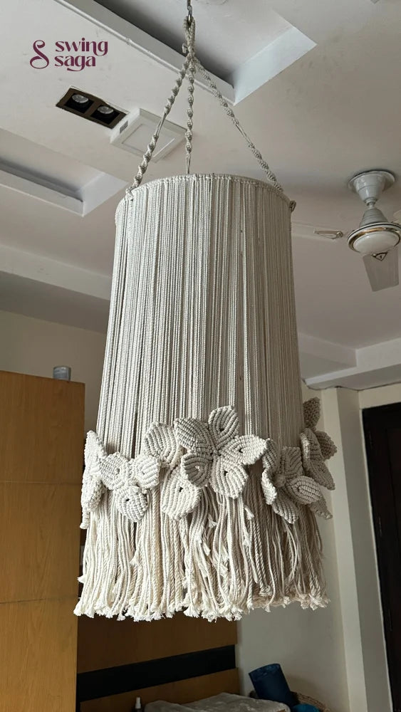 Cream macrame chandelier with floral accents and top ring hanger