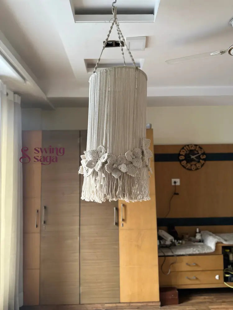 Stylish cream macrame chandelier in cream color with delicate flowers and a circular hanging ring