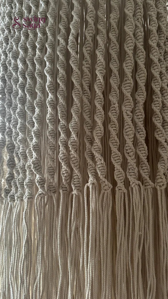 Detailed textureshot of macrame chandelier featuring fine knot patterns and weaving