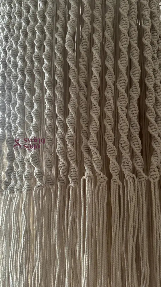 Detailed textureshot of macrame chandelier featuring fine knot patterns and weaving