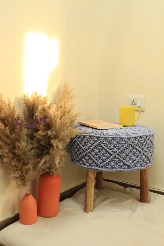 Sky blue handcrafted macrame ottoman.