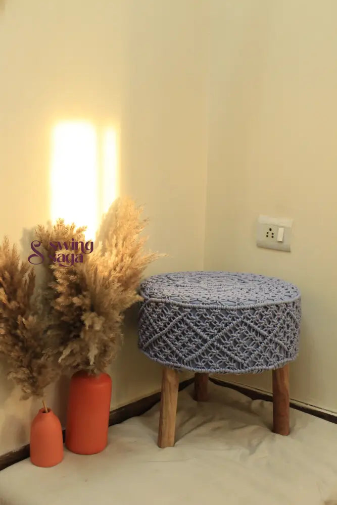 Light blue macrame handwoven ottoman.