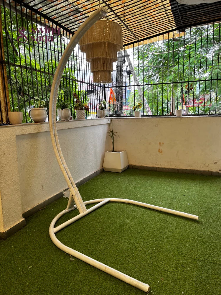 Metal white stand on a faux grass mat