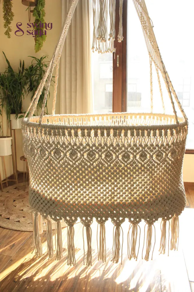 Bohemian macrame hanging swing chair made from cotton rope – decorative indoor hanging swing